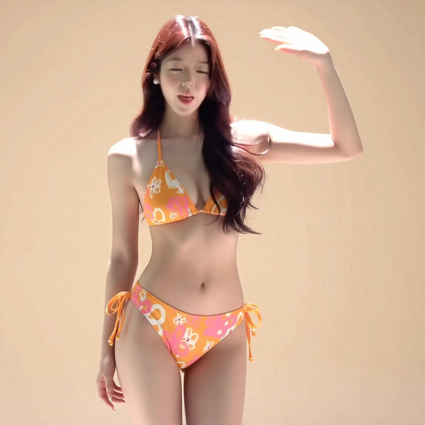 Three-piece orange bikini set with long-sleeve print cover-up