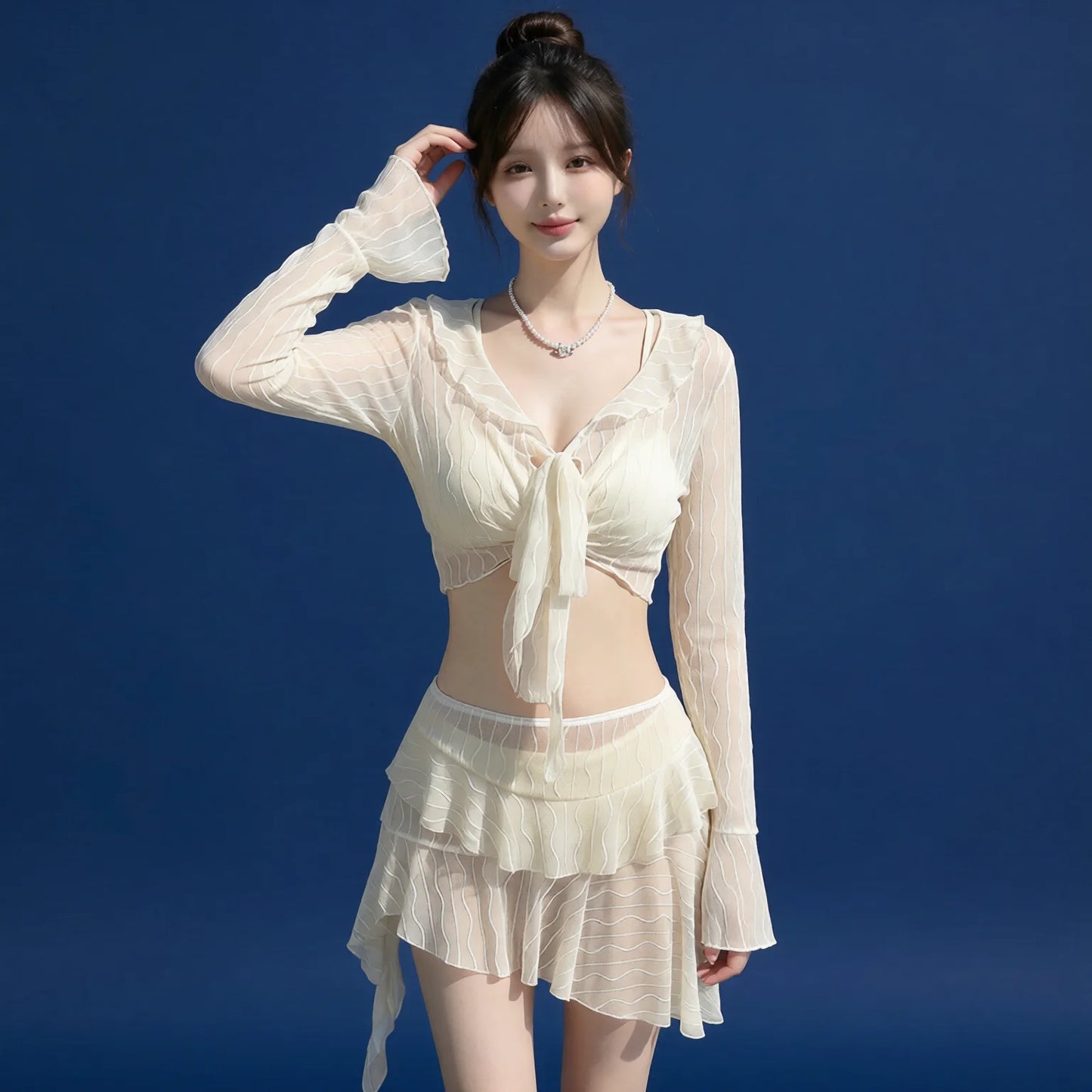 Ivory bikini set with long sleeves, tiered skirt & tie-front crop