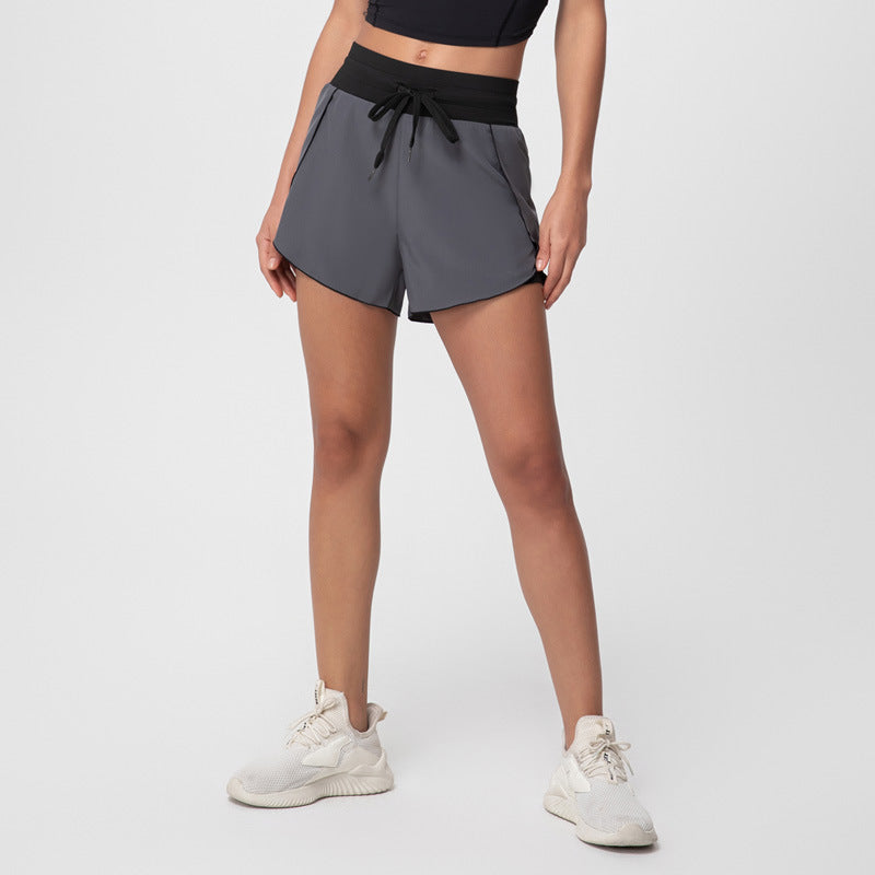 High-waisted shorts with pockets - seamless sports shorts with drawstring tie
