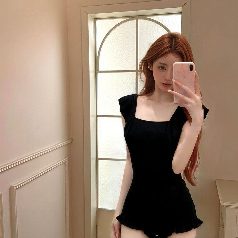 One-piece swimsuit with leaf trim, ruched waist and moderate coverage