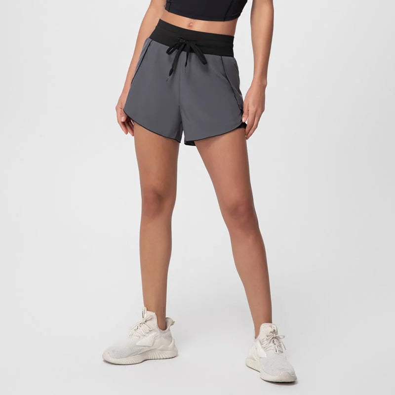 High-waisted shorts with pockets - seamless sports shorts with drawstring tie