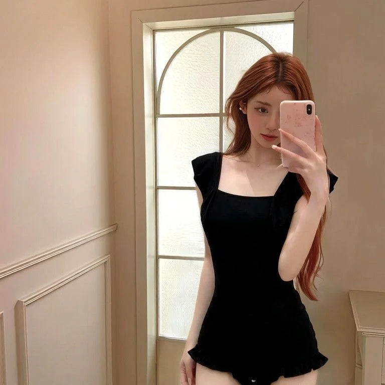 One-piece swimsuit with leaf trim, ruched waist and moderate coverage